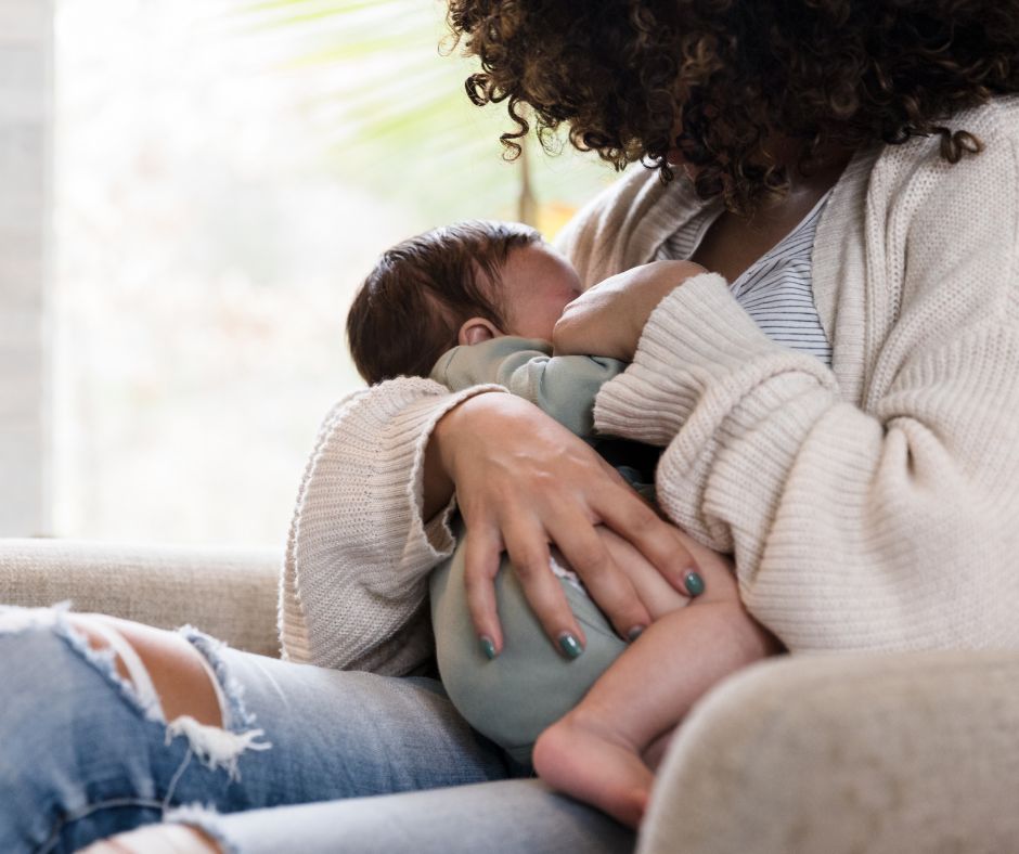 Mother breastfeeding a baby in a sunny room; Breastfeeding Education and Lactation Support